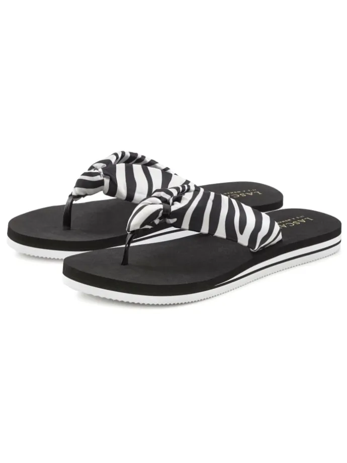 Badezehentrenner in schwarz/weiß