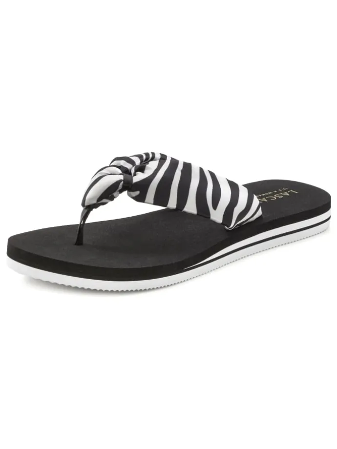 Badezehentrenner in schwarz/weiß