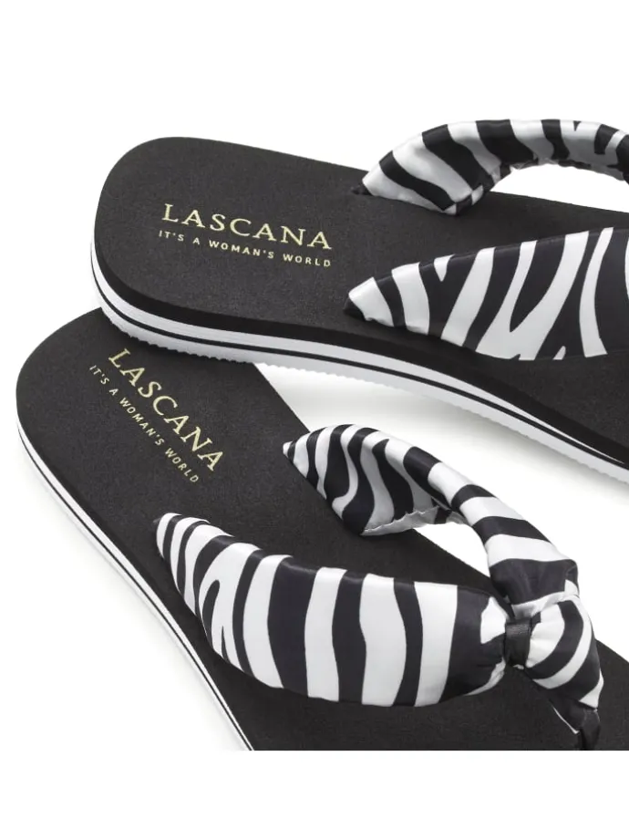 Badezehentrenner in schwarz/weiß