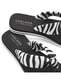 Badezehentrenner in schwarz/weiß